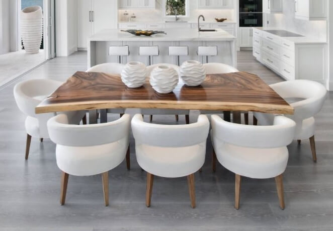 Live edge walnut dining table in contemporary kitchen. Interior design by Natasha Pereira Interior Design in Naples, FL and Design Studio by Raymond. Image by Giovanni Photography.