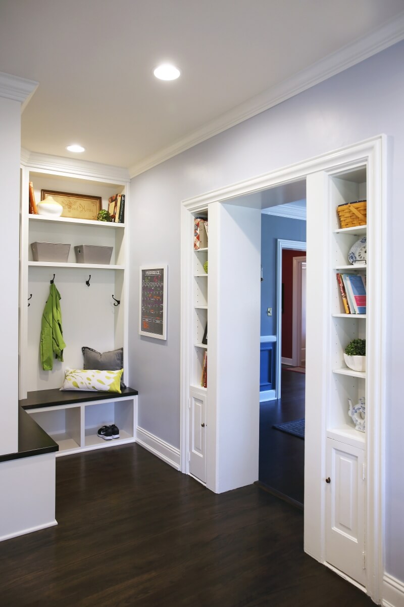 The doorway into the dining room was framed with built-in cabinetry and shelving to add a space for the homeowners to display decor while providing additional storage.