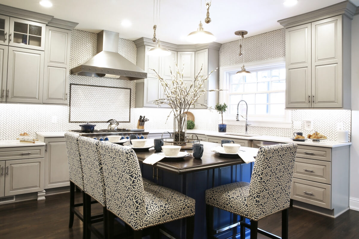 A beautiful blue kitchen island was added to include seating for all 4 family members.