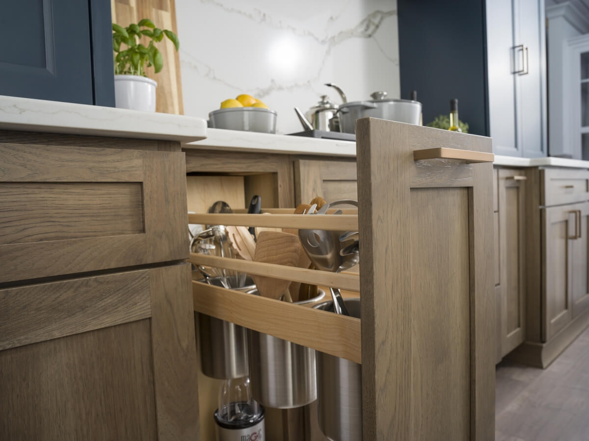 A Kitchen Utensil Pull-Out cabinet provides and easy to access space to organize your larger kitchen utensils.