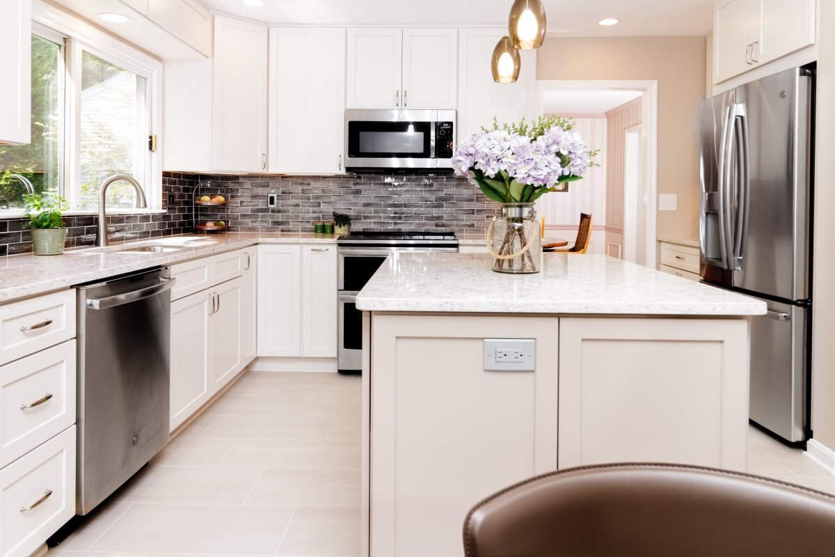 An example of a charming bright white U-Shaped kitchen designed by House to Home Solutions.