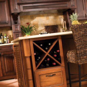 A base kitchen cabinet with a large x wine rack and a drawer below shown on a kitchen island.