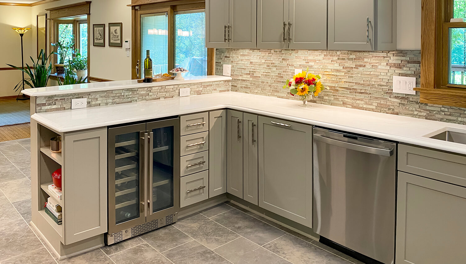 A kitchen peninsula with two levels of countertops.