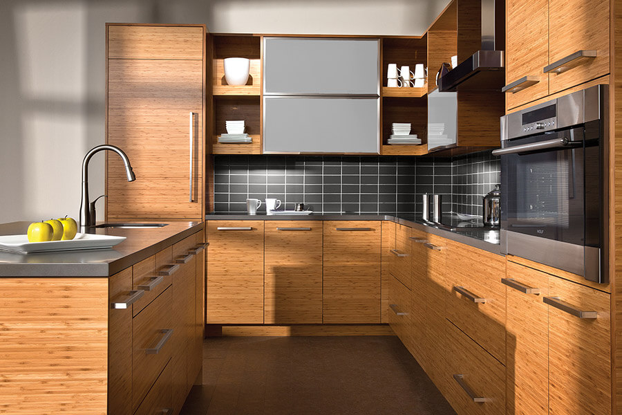 An asian zen styled contemporary kitchen design with horizontal grain bamboo cabinets in a slab cabinet door. This kitchen also features horizontal aluminumn framed cabinet doors with a white frosted glass insert. Learn about contemporary kitchen desing style and how to shop for modern cabinetry.