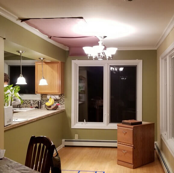 Kitchen makeover story. Before photo of the window where the designer put the new window seat and home office storage cabinets.