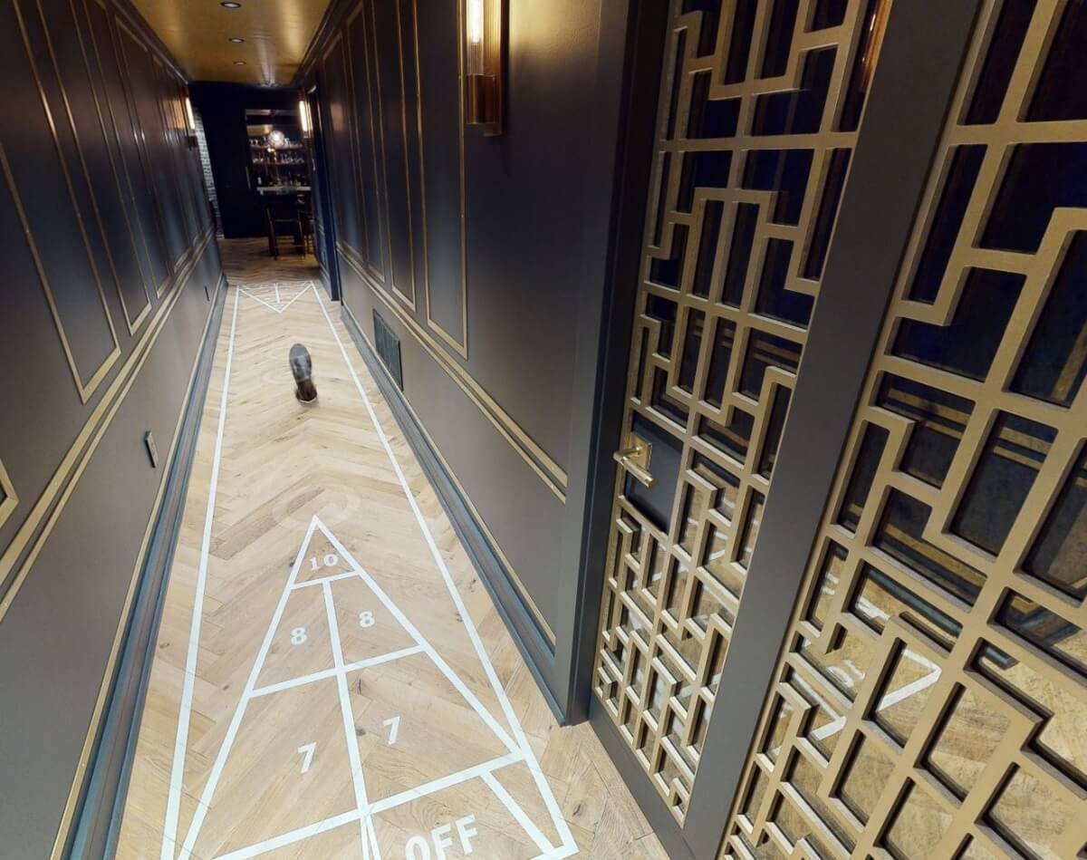 A Shuffleboard game was incorporated into the hallway flooring to offer a fun use of the space.