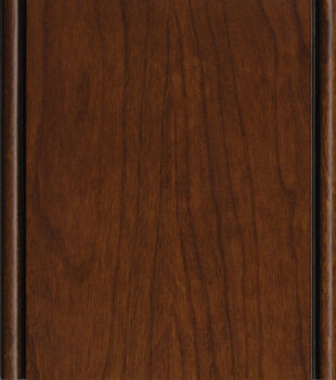 A cabinet finish sample of the Allspice stain on Cherry wood with a black accent glaze detail by Dura Supreme Cabinetry.