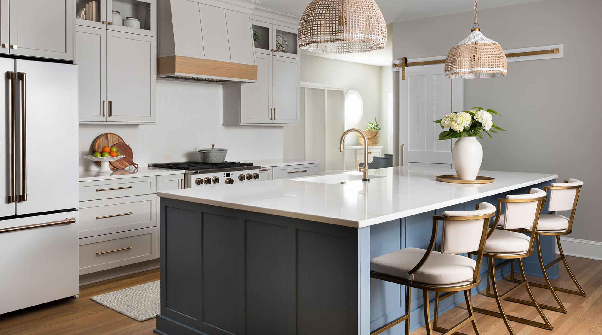 Kitchen island seating with standard countertop height in a blue and white modern farmhouse kitchen remodel.