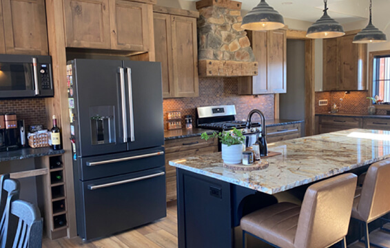 Cabinetry Testimony of a traditional lodge styled kitchen with wood cabinets from Dura Supreme.