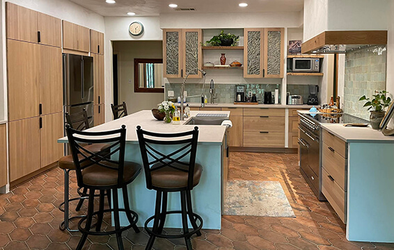A texas home remedeled with new Dura Supreme cabinets with a light wood stain.