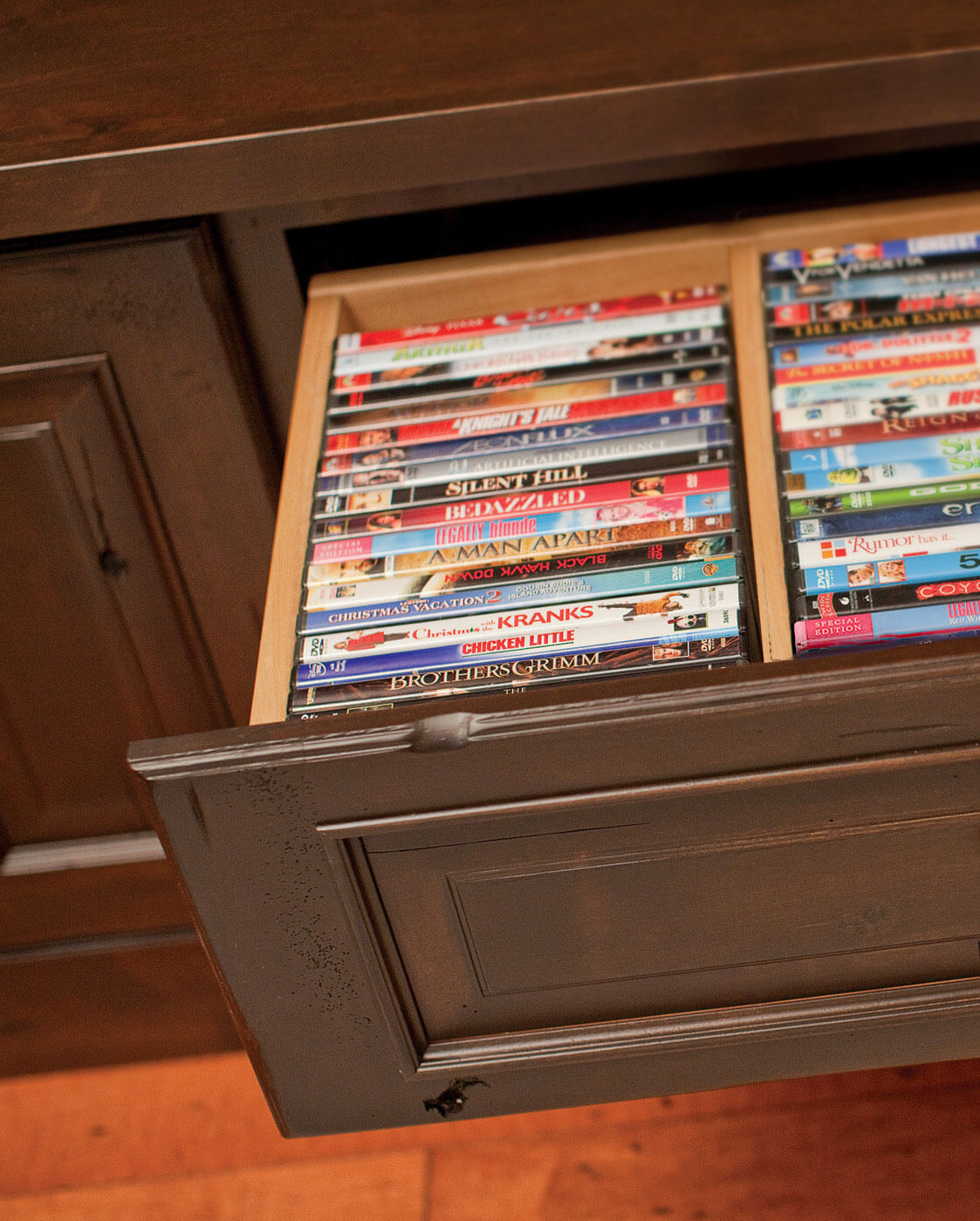 Keep DVD's CD's and Gaming disc boxes in orderly rows with drawer partitions for entertainment center cabinets.