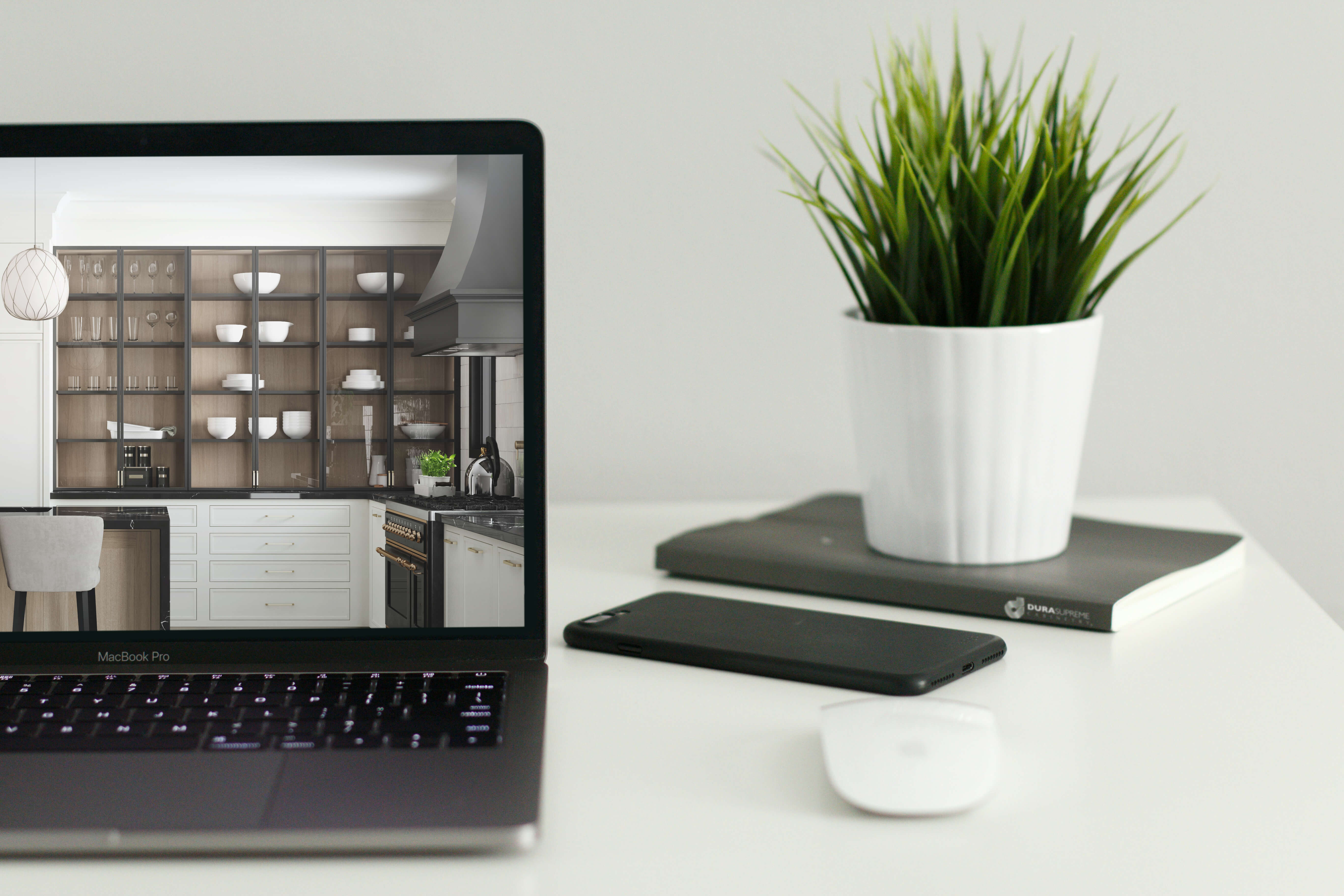 A computer screen showing a new kitchen with Dura Supreme Cabinetry.