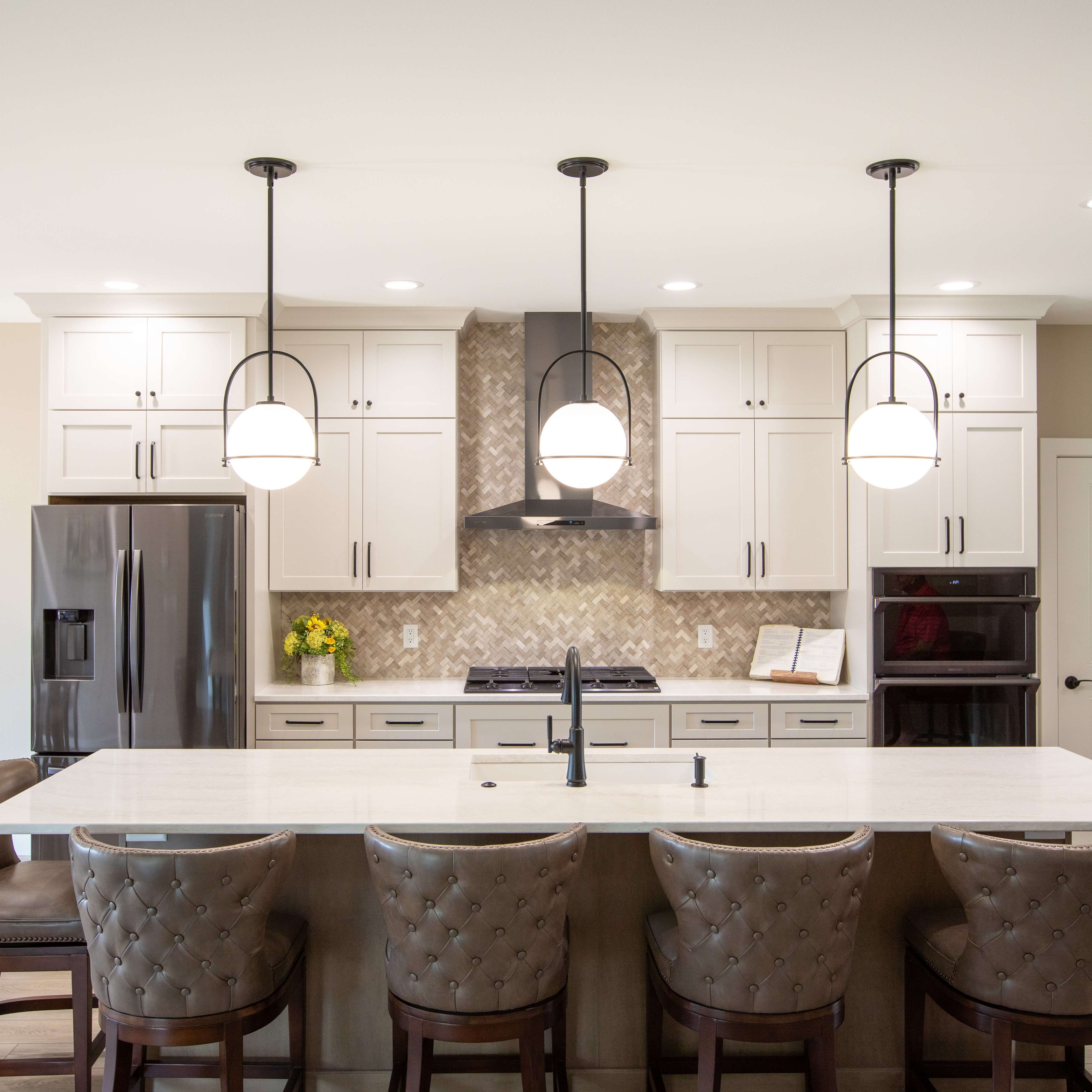 A white and gray kitchen design with a cozy design.