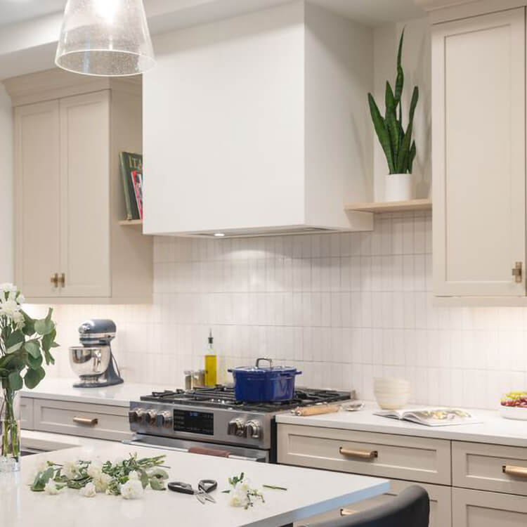 A transitional style kitchen with a modern box style wood hood from Dura Supreme Cabinetry.