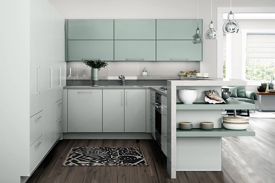 A modern kitchen with a coastal inspired color palette and high-tech matte cabinetry.