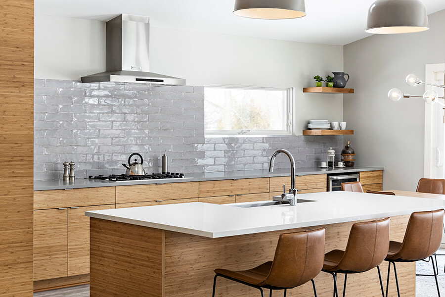An Asian Zen styled contemporary kitchen design with horizontal grain bamboo cabinets in a slab cabinet door.