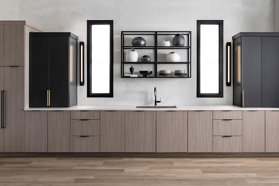A modern kitchen with a spacious vibe, open metal shelves, and two-toned contemporary cabinets.