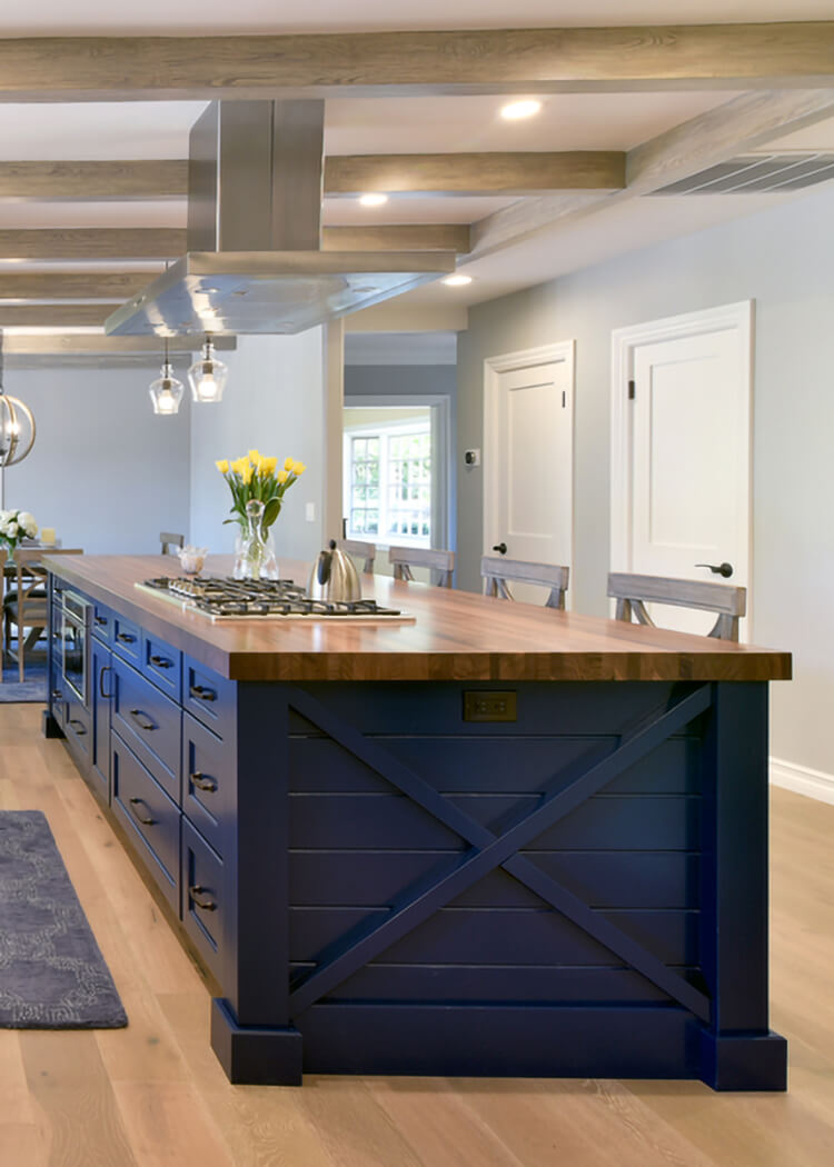 a Nautical style kitchen island with a navy blue painted finish and an X-end-cap with shiplap details.