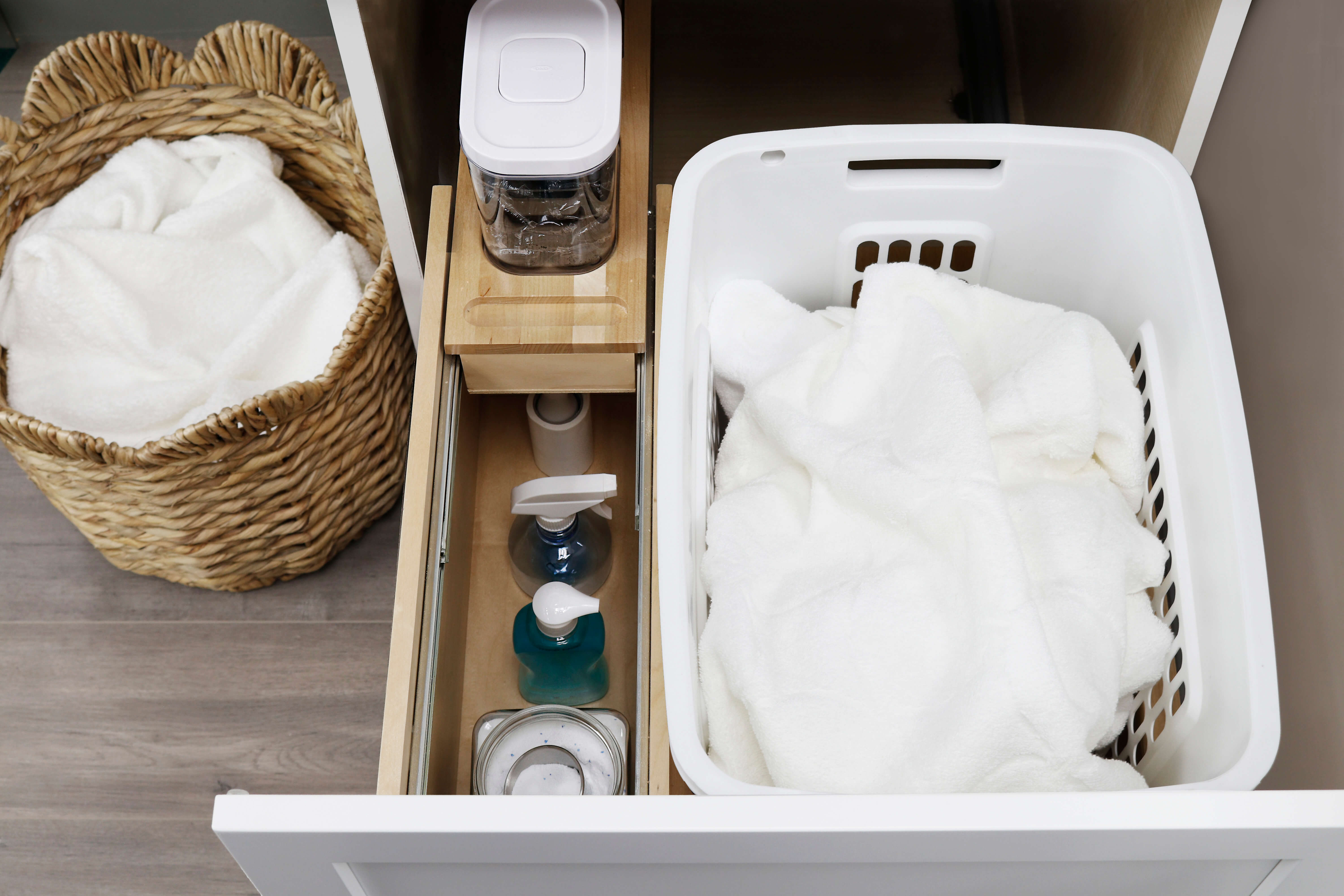 Dura Supreme's Laundry Hamper Pull-Out shown from the a top view with the side compartment in the open position. 