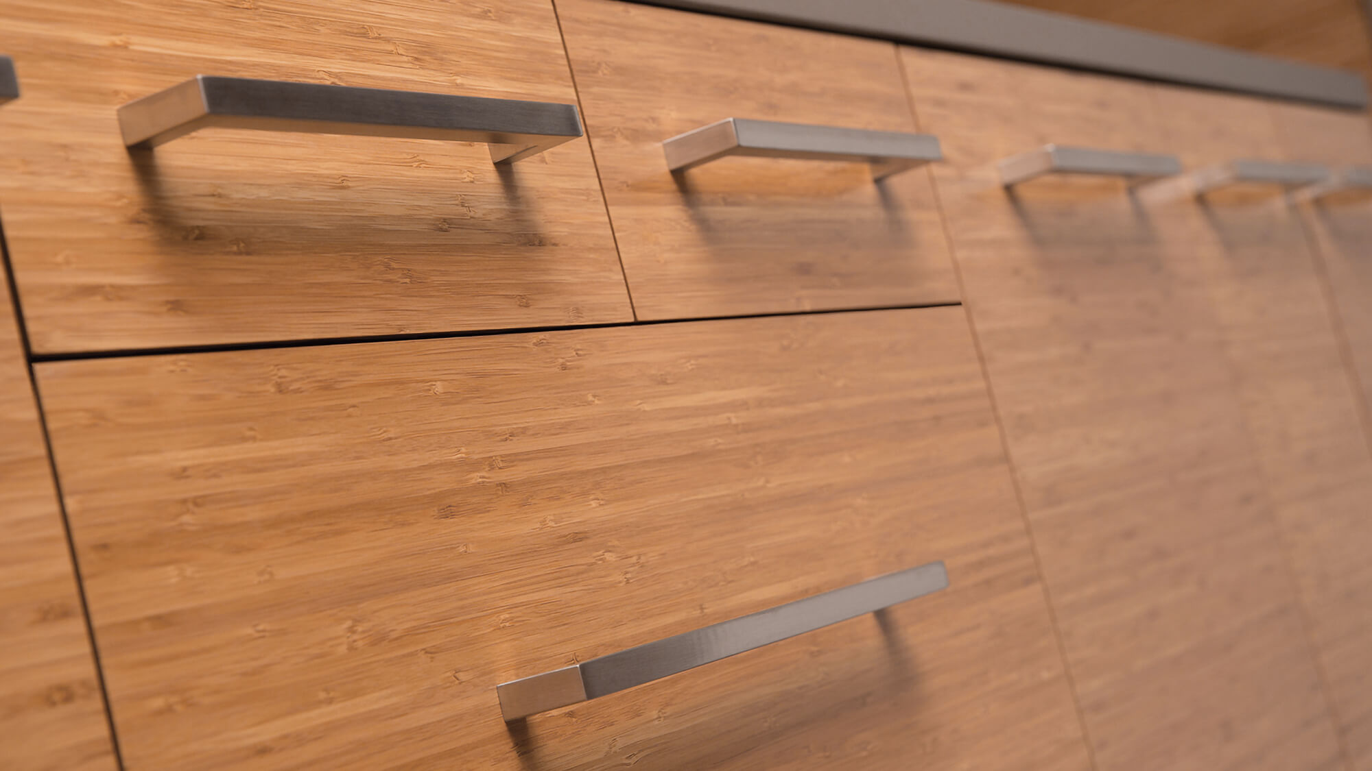 A close up of Dura Supreme's Bamboo cabinets with a natural finish.